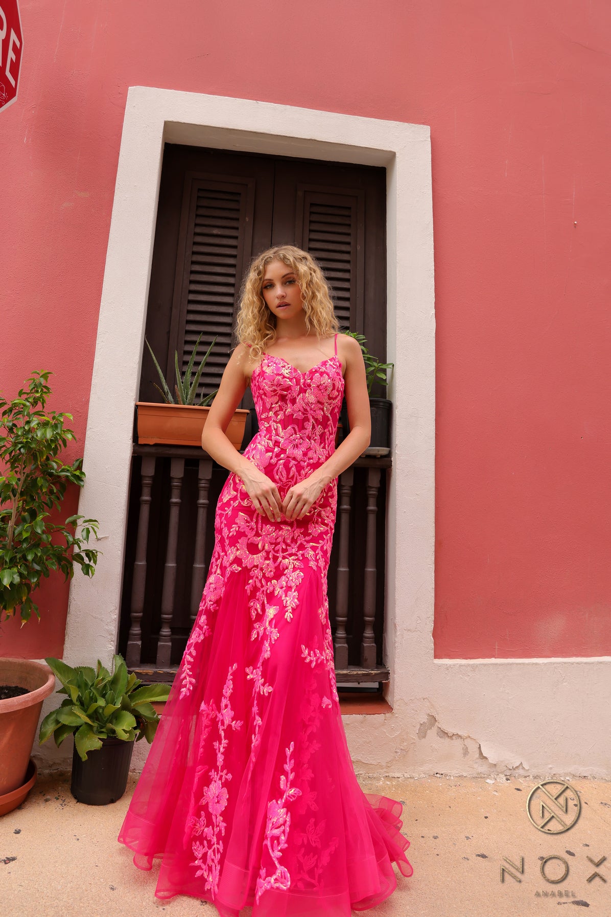 Elevate your prom or pageant look with the Nox Anabel Q1390 Prom Dress. Featuring a long sequin body with a sheer corset and mermaid silhouette, this dress will have you shining all night. Stand out in vibrant neon while feeling confident and elegant.  Sizes: 0-16  Colors: Neon Green, Neon Orange, Coral Fuchsia, Ocean Blue