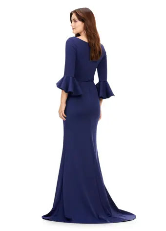 Ashley Lauren 11325 Crew Neck Three Quarter Flutter Sleeves Ruched Skirt Fitted Gown. This timeless and elegent evening gown features flutter three quarter sleeves. The skirt is adorned with ruching and finished with a sweep train.