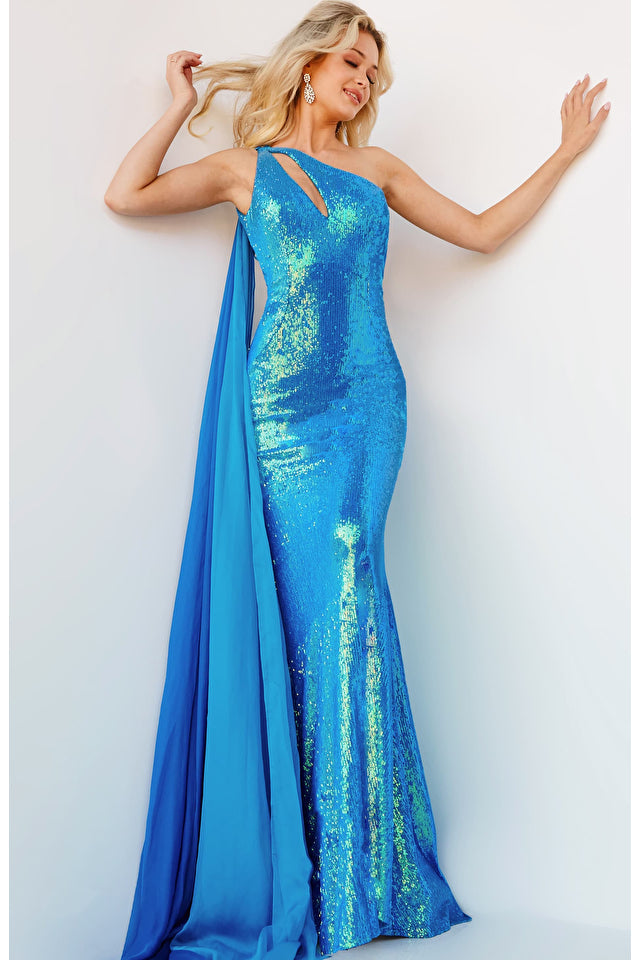 Jovani 08012 is a stunning, one-shoulder prom dress with a keyhole neckline, floor-length cape and iridescent fabric. It offers a figure-flattering silhouette with a high waistline and fitted upper body. Perfect for any formal occasion, the cape adds drama to this glamorous look!