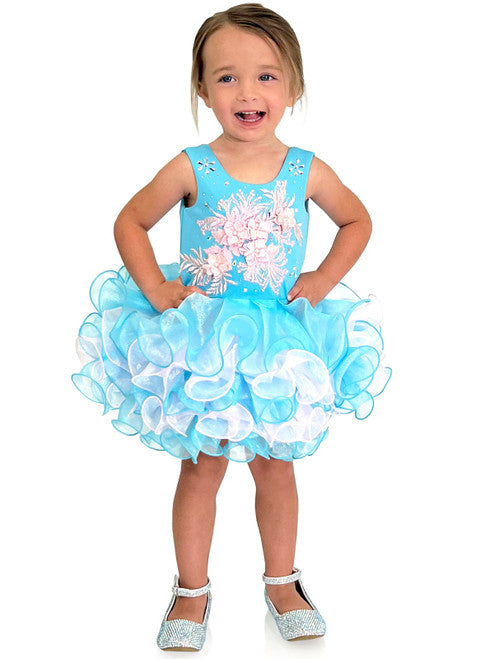 Marc Defang 5117K size 8 Turquoise girls cupcake pageant dress with pink applique on the top with crystal scattered throughout.  Multi blue and pink ruffle skirt.  Size 8  Color: Turquoise