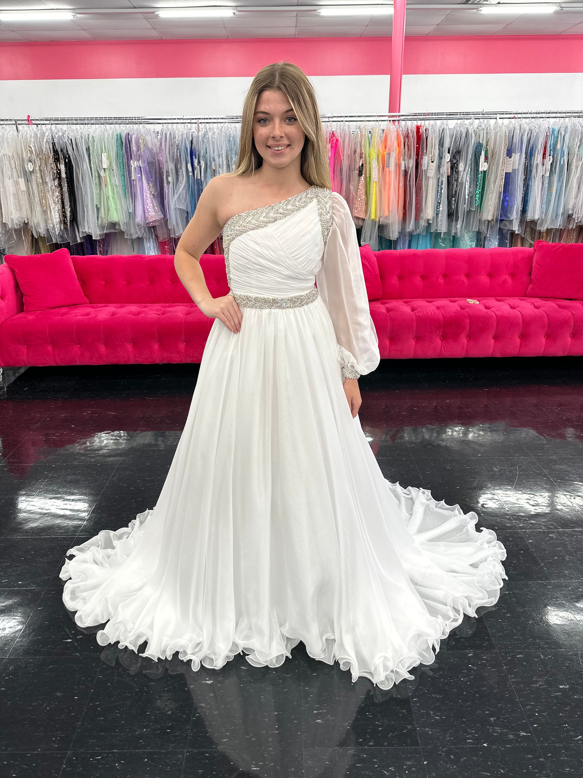 Be the epitome of grace and elegance in the Samanatha Blake 1014 one shoulder Long Sleeve Pageant Dress. Made with delicate chiffon and a stunning crystal embellished bodice, this dress features a one-shoulder design and long sleeves for a sophisticated look. Perfect for any pageant or formal event.