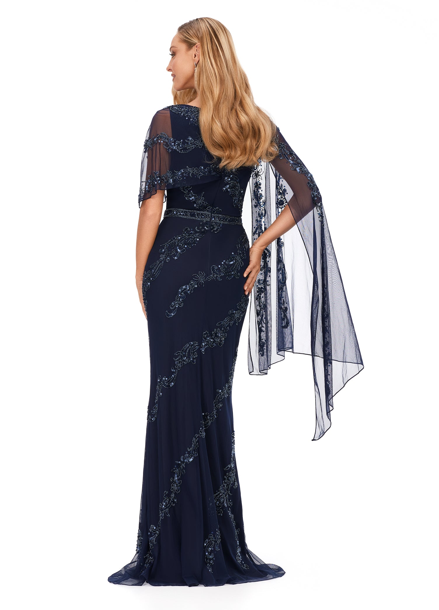 Ashley Lauren 11213 Asymmetric Detachable Overlay High Back Fully Hand Beaded Crew Neckline Evening Dress. This stunning evening gown is complete with an intricate bead motif. The bustier is adorned with an asymmetrical overlay which falls down the left arm.