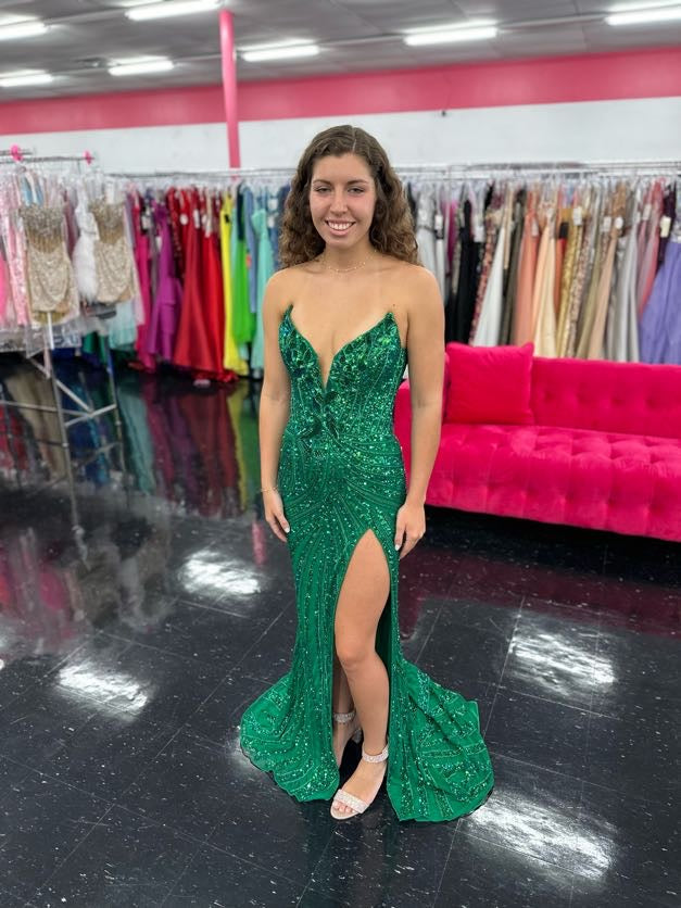 Ashley Lauren 11236 Long Fitted V Neck Slit Beaded Sequin Prom Dress Pageant Gown This strapless gown is sure to turn heads. The sweetheart neckline is complete with a modern floral sequin motif that continues down the bustier and skirt. The skirt is complete with a left leg slit.