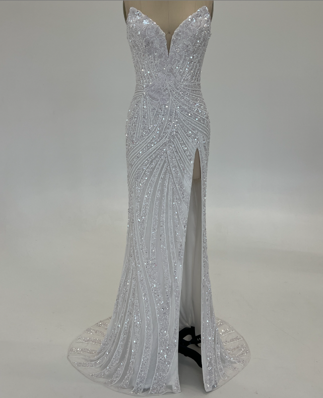 Ashley Lauren 11236 Long Fitted V Neck Slit Beaded Sequin Prom Dress Pageant Gown This strapless gown is sure to turn heads. The sweetheart neckline is complete with a modern floral sequin motif that continues down the bustier and skirt. The skirt is complete with a left leg slit.