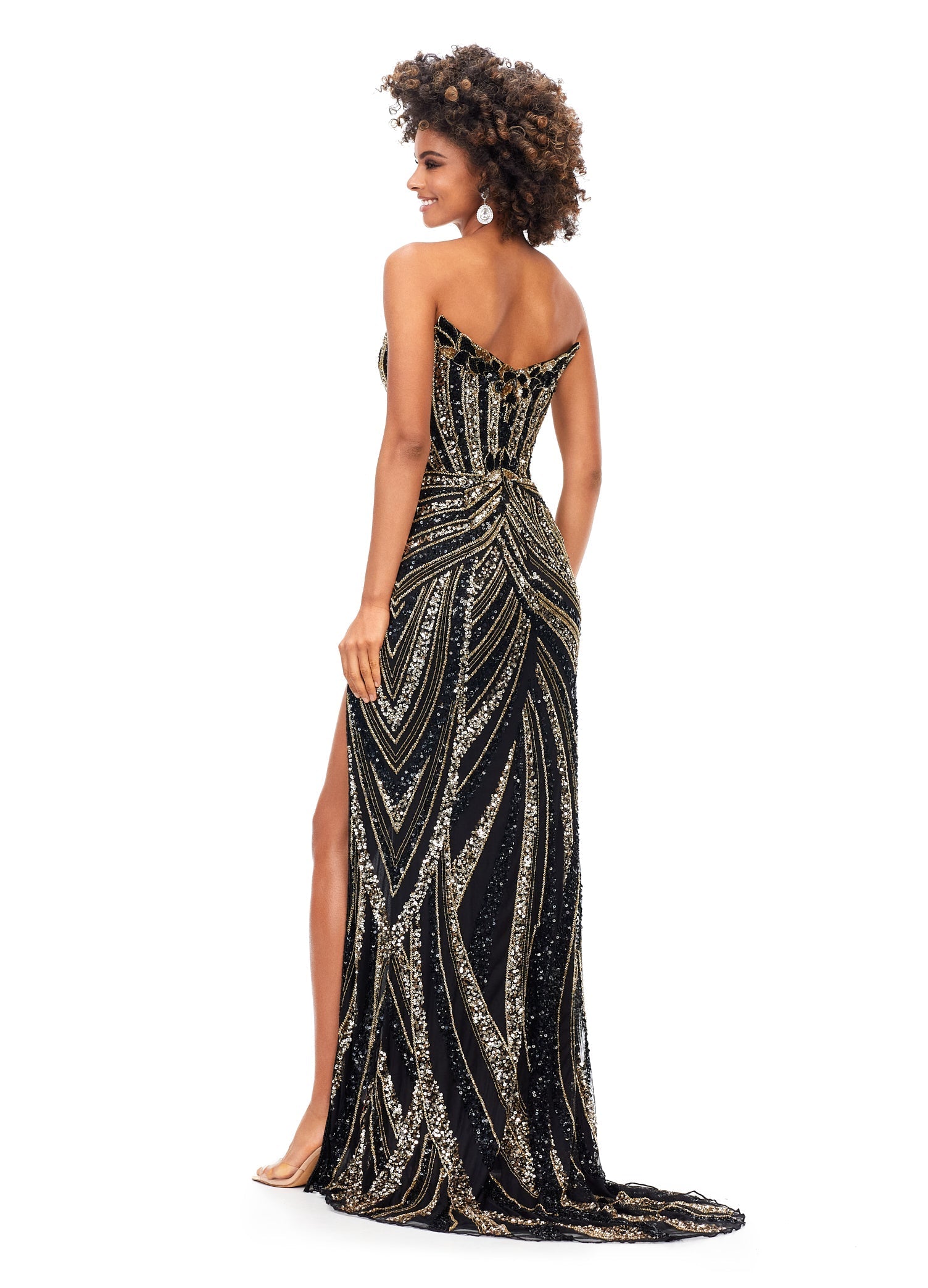 Ashley Lauren 11236 Long Fitted V Neck Slit Beaded Sequin Prom Dress Pageant Gown This strapless gown is sure to turn heads. The sweetheart neckline is complete with a modern floral sequin motif that continues down the bustier and skirt. The skirt is complete with a left leg slit. Strapless Bustier Left Leg Slit Fully Hand Beaded COLORS: Gold, Rose Gold, Gold/Black, Sky/Nude, Gold/Ivory, Fuchsia/Black, Purple, Red, Fuchsia, Bright Pink, Blue/Jade Sizes: 0-16