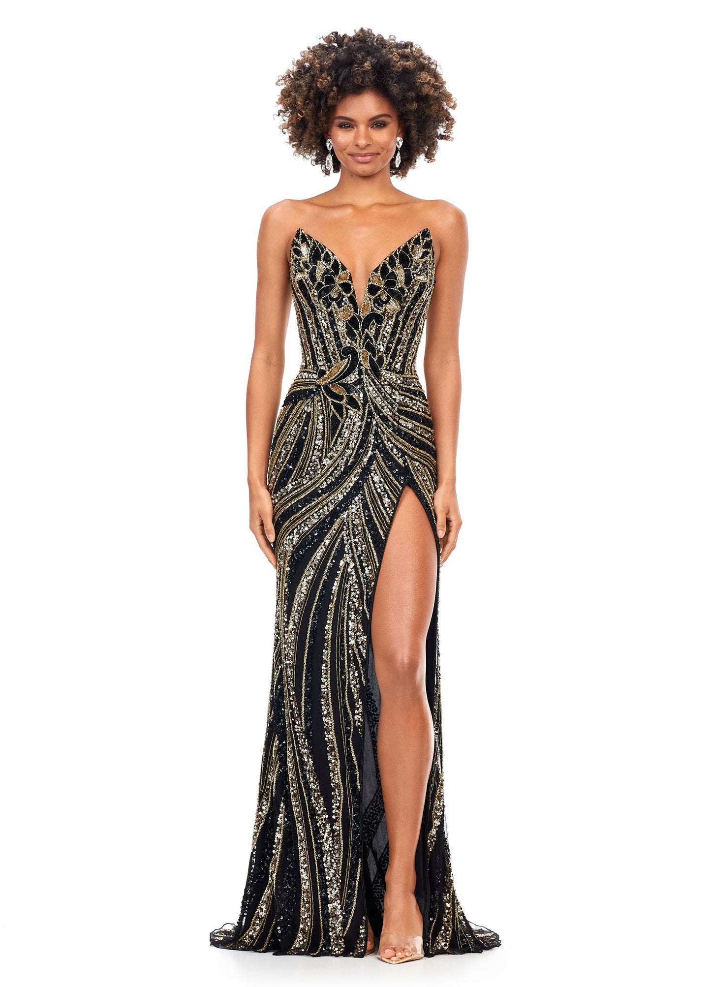 Ashley Lauren 11236 Long Fitted V Neck Slit Beaded Sequin Prom Dress Pageant Gown This strapless gown is sure to turn heads. The sweetheart neckline is complete with a modern floral sequin motif that continues down the bustier and skirt. The skirt is complete with a left leg slit. Strapless Bustier Left Leg Slit Fully Hand Beaded COLORS: Gold, Rose Gold, Gold/Black, Sky/Nude, Gold/Ivory, Fuchsia/Black, Purple, Red, Fuchsia, Bright Pink, Blue/Jade Sizes: 0-16