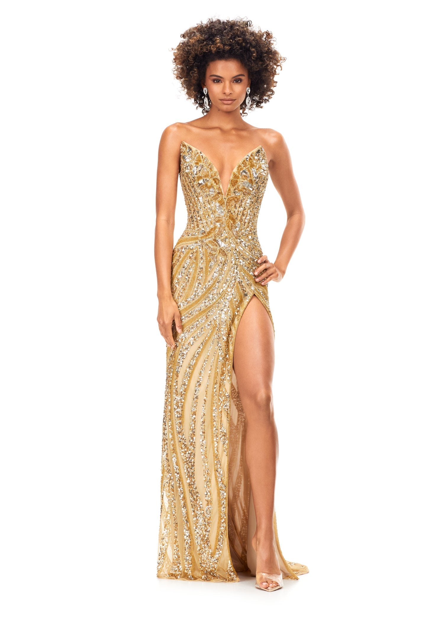 Ashley Lauren 11236 Long Fitted V Neck Slit Beaded Sequin Prom Dress Pageant Gown This strapless gown is sure to turn heads. The sweetheart neckline is complete with a modern floral sequin motif that continues down the bustier and skirt. The skirt is complete with a left leg slit. Strapless Bustier Left Leg Slit Fully Hand Beaded COLORS: Gold, Rose Gold, Gold/Black, Sky/Nude, Gold/Ivory, Fuchsia/Black, Purple, Red, Fuchsia, Bright Pink, Blue/Jade Sizes: 0-16