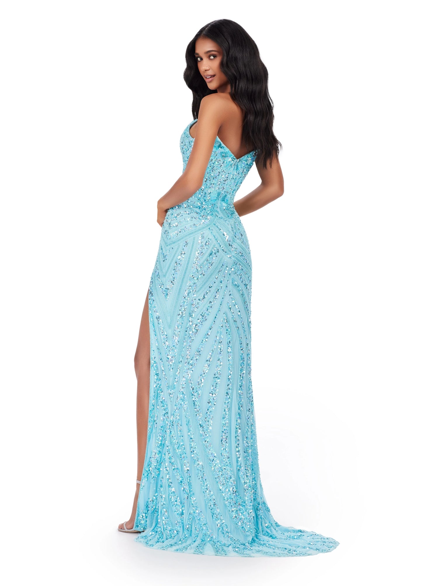 Ashley Lauren 11236 Long Fitted V Neck Slit Beaded Sequin Prom Dress Pageant Gown This strapless gown is sure to turn heads. The sweetheart neckline is complete with a modern floral sequin motif that continues down the bustier and skirt. The skirt is complete with a left leg slit.  COLORS: Blue/Jade, Candy Pink, Gold/Black, Lilac, Sky, Silver/Nude, Electric Lime, Bright Pink, Sky/Nude, Coral, Silver/Ivory, Turquoise/Royal, Rose Gold, Gold/Ivory, Red, Gold Sizes: 00-16