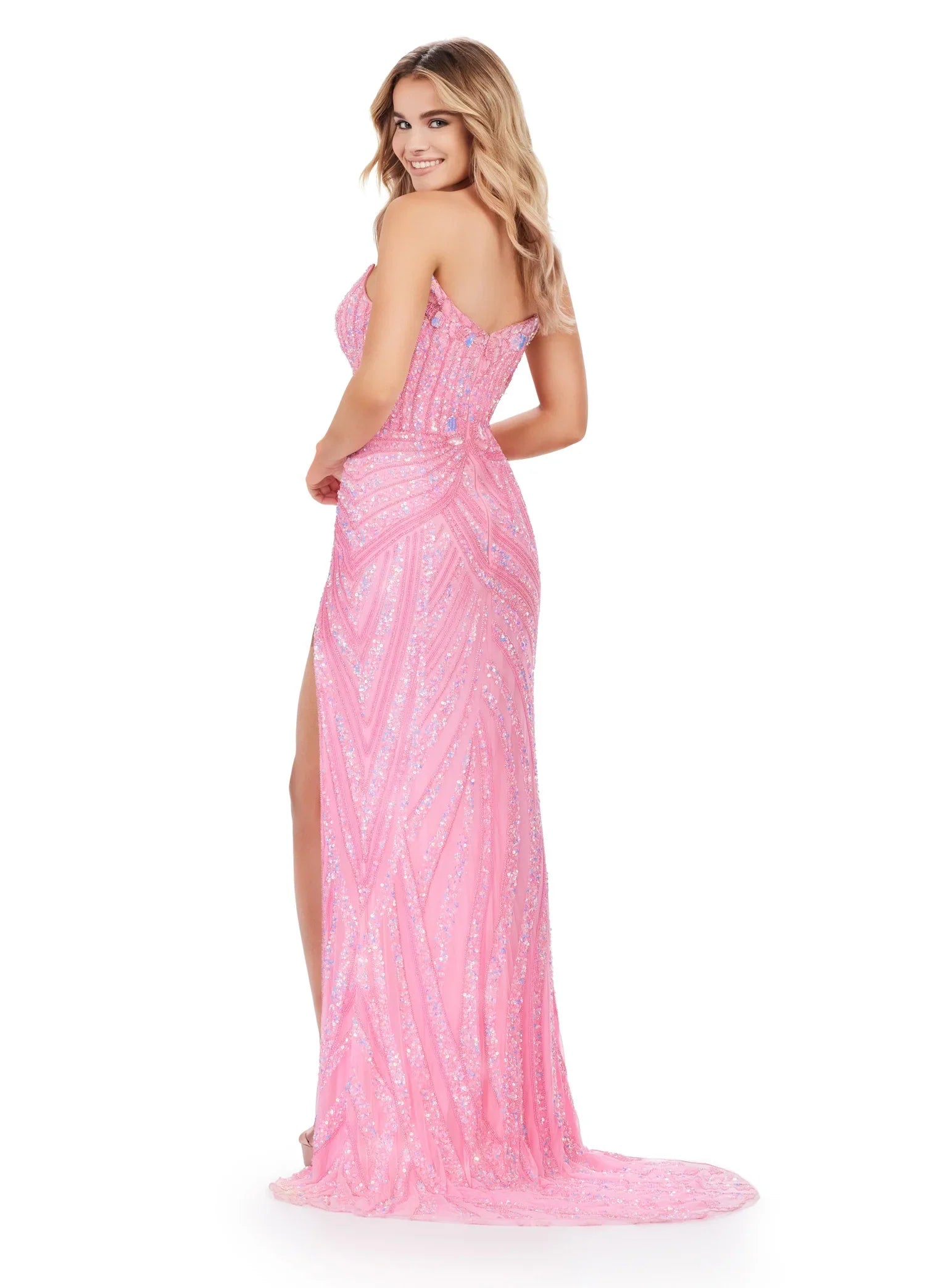 Ashley Lauren 11236 Long Fitted V Neck Slit Beaded Sequin Prom Dress Pageant Gown This strapless gown is sure to turn heads. The sweetheart neckline is complete with a modern floral sequin motif that continues down the bustier and skirt. The skirt is complete with a left leg slit.  COLORS: Blue/Jade, Candy Pink, Gold/Black, Lilac, Sky, Silver/Nude, Electric Lime, Bright Pink, Sky/Nude, Coral, Silver/Ivory, Turquoise/Royal, Rose Gold, Gold/Ivory, Red, Gold Sizes: 00-16