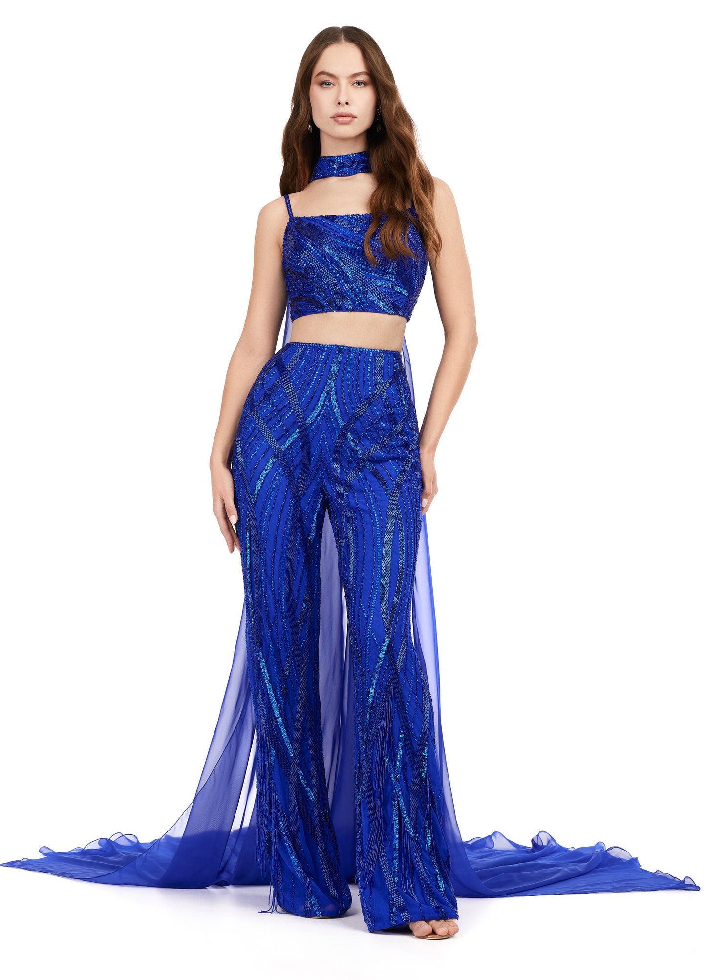 Ashley Lauren 11385 Fully Beaded 2-Piece With Chiffon Cape Spaghetti Strap Jumpsuit. Bring on the drama in this jumpsuit. The bustier and pants are adorned with an intricate bead pattern. The bead pattern continues along the chocker. The choker is complete with a long chiffon cape.