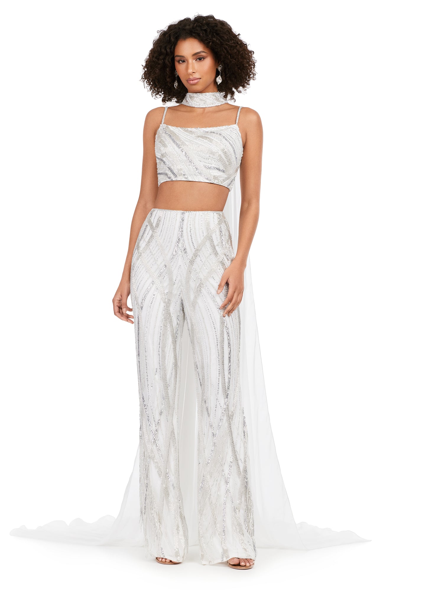 Ashley Lauren 11385 Fully Beaded 2-Piece With Chiffon Cape Spaghetti Strap Jumpsuit. Bring on the drama in this jumpsuit. The bustier and pants are adorned with an intricate bead pattern. The bead pattern continues along the chocker. The choker is complete with a long chiffon cape.