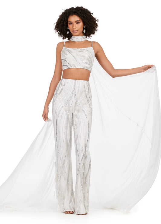 Ashley Lauren 11385 Fully Beaded 2-Piece With Chiffon Cape Spaghetti Strap Jumpsuit. Bring on the drama in this jumpsuit. The bustier and pants are adorned with an intricate bead pattern. The bead pattern continues along the chocker. The choker is complete with a long chiffon cape.