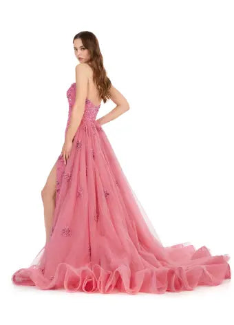 Elevate any special occasion in this exquisite Ashley Lauren 11405 Long Prom Dress. With a fully beaded strapless bodice and luxurious tulle overskirt, this formal pageant gown is the epitome of elegance. Be the center of attention and exude confidence in this stunning dress. Shine bright in this glamorous strapless, fully sequined gown. Paired with it's full tulle overskirt and glimmering beadwork, this gown is sure to stand out.