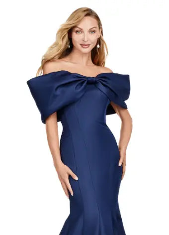 Experience elegance with the Ashley Lauren 11413 Long Prom Dress. Designed with an off-shoulder neckline, this dress is crafted from luxurious double-faced satin and features an oversized bow for added drama. Perfect for formal events and pageants, this dress will make you stand out with its sophisticated and flattering silhouette. Talk about elegant. This off shoulder gown is complete with an oversized bow along the neckline. This double faceted satin gown has a mermaid silhouette.