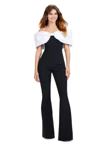 Make a statement at your next formal event with the Ashley Lauren 11414 Off Shoulder Scuba Jumpsuit. Its stylish off-shoulder design and oversized bow add a touch of elegance, while the scuba material provides a comfortable and flattering fit. Perfect for prom or any special occasion. Turn heads in this jumpsuit! This look is complete with an oversized bow off shoulder neckline.