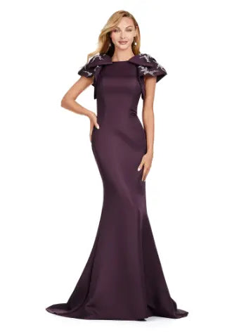 Elevate your evening look with the Ashley Lauren 11415 Long Prom Mermaid Dress. This stunning gown features a double-faced satin fabric and intricate bow detail, perfect for a formal event or pageant. Embrace timeless elegance and make a statement with this expertly crafted dress. Make an entrance in this double faced satin gown complete with bow shoulders and beaded details. in this memorable dress styled with radiant beading on the layered shoulder straps.