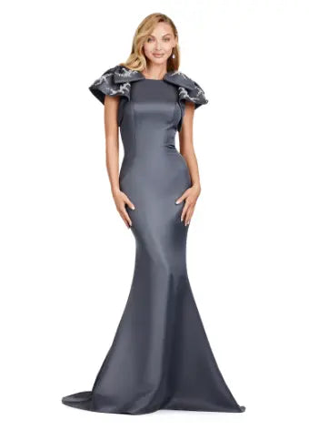 Elevate your evening look with the Ashley Lauren 11415 Long Prom Mermaid Dress. This stunning gown features a double-faced satin fabric and intricate bow detail, perfect for a formal event or pageant. Embrace timeless elegance and make a statement with this expertly crafted dress. Make an entrance in this double faced satin gown complete with bow shoulders and beaded details. in this memorable dress styled with radiant beading on the layered shoulder straps.