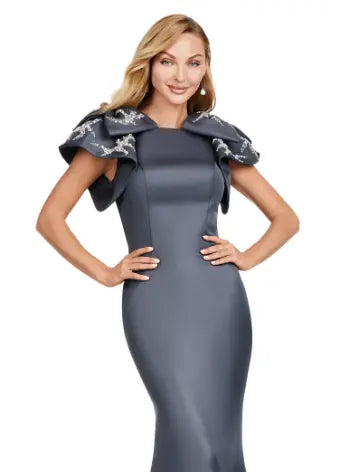 Elevate your evening look with the Ashley Lauren 11415 Long Prom Mermaid Dress. This stunning gown features a double-faced satin fabric and intricate bow detail, perfect for a formal event or pageant. Embrace timeless elegance and make a statement with this expertly crafted dress. Make an entrance in this double faced satin gown complete with bow shoulders and beaded details. in this memorable dress styled with radiant beading on the layered shoulder straps.