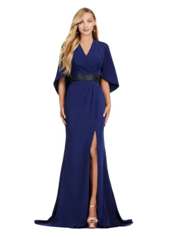 Discover elegance and sophistication with the Ashley Lauren 11416 Long Prom Dress. Made from crepe fabric and adorned with a beaded belt, this dress boasts a sleek and modern look. With an overlay and slit, it is perfect for formal occasions or pageants. Stand out in style and confidence. Dazzle all night in this elegant evening gown. The ruched V-Neck bustier is adorned with a beaded belt and a modern overlay. The wrap skirt is complete with a left leg slit.