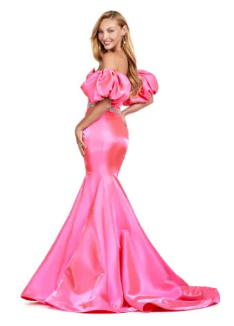 Expertly crafted by Ashley Lauren, this 11419 Long Prom Dress boasts a stunning mermaid silhouette with a strapless design and luxurious satin fabric. The oversized puff sleeves add a bold and elegant touch, making you stand out at any formal event or pageant. Elevate your look with this timeless and sophisticated gown.  Voluminous puff sleeves and a classic sweetheart neckline frame this stunning gown. With its mermaid fit and jeweled belt, this gown is a dream come true!