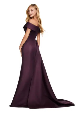 This Ashley Lauren 11425 Long Prom Dress is the perfect choice for any formal occasion. The off-shoulder design adds a touch of elegance, while the fitted satin fabric hugs your figure for a flattering silhouette. The overskirt adds a dramatic flare, making you feel like a pageant queen. Elevate your style with this versatile and stunning dress. An elegant off the shoulder neckline drapes the shoulders in elegant evening gown. The look is complete with beaded details and a side overskirt.