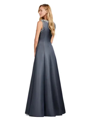 Step into sophistication with the Ashley Lauren 11426 Long Prom Dress. Made from luxurious satin, this A-line dress features a crew neckline and elegant silhouette perfect for formal events and pageants. Elevate your style with this timeless and versatile piece. Dazzle in this elegant and modern evening gown. With beautiful beaded details, this dress is sure to make an entrance. The dress is adorned with crystal details and a slight A-line skirt.