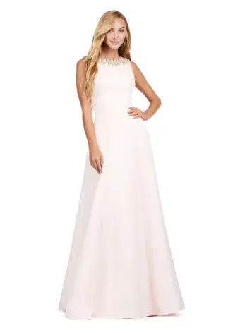 Step into sophistication with the Ashley Lauren 11426 Long Prom Dress. Made from luxurious satin, this A-line dress features a crew neckline and elegant silhouette perfect for formal events and pageants. Elevate your style with this timeless and versatile piece. Dazzle in this elegant and modern evening gown. With beautiful beaded details, this dress is sure to make an entrance. The dress is adorned with crystal details and a slight A-line skirt.