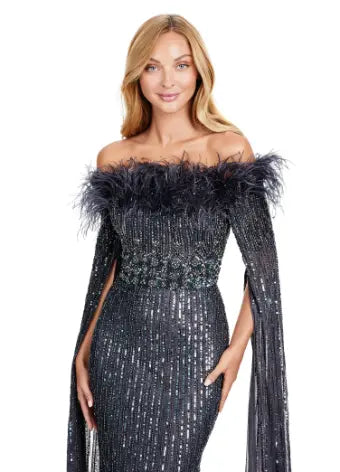 Expertly crafted by Ashley Lauren, the 11429 Long Prom Dress is a stunning piece that combines fully sequined fabric, delicate feathers, and elegant floor-length sleeves. Perfect for formal events and pageants, this gown is sure to make you stand out with its unique design and impeccable craftsmanship. Bring all the glamour in this fully beaded gown with floor length sleeves. The feather details take this look to the next level.