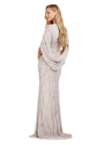 This long prom dress by Ashley Lauren 11430 features a stunning sequin V-neck and elegant cape sleeves, perfect for a formal pageant or evening event. The modern design and quality construction make it a must-have for any fashion-forward individual looking to make a statement. Look and feel confident in this unique, eye-catching gown. 