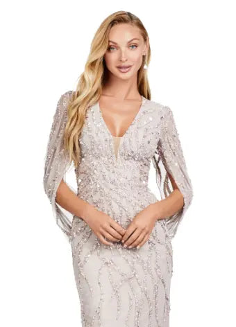 This long prom dress by Ashley Lauren 11430 features a stunning sequin V-neck and elegant cape sleeves, perfect for a formal pageant or evening event. The modern design and quality construction make it a must-have for any fashion-forward individual looking to make a statement. Look and feel confident in this unique, eye-catching gown. 