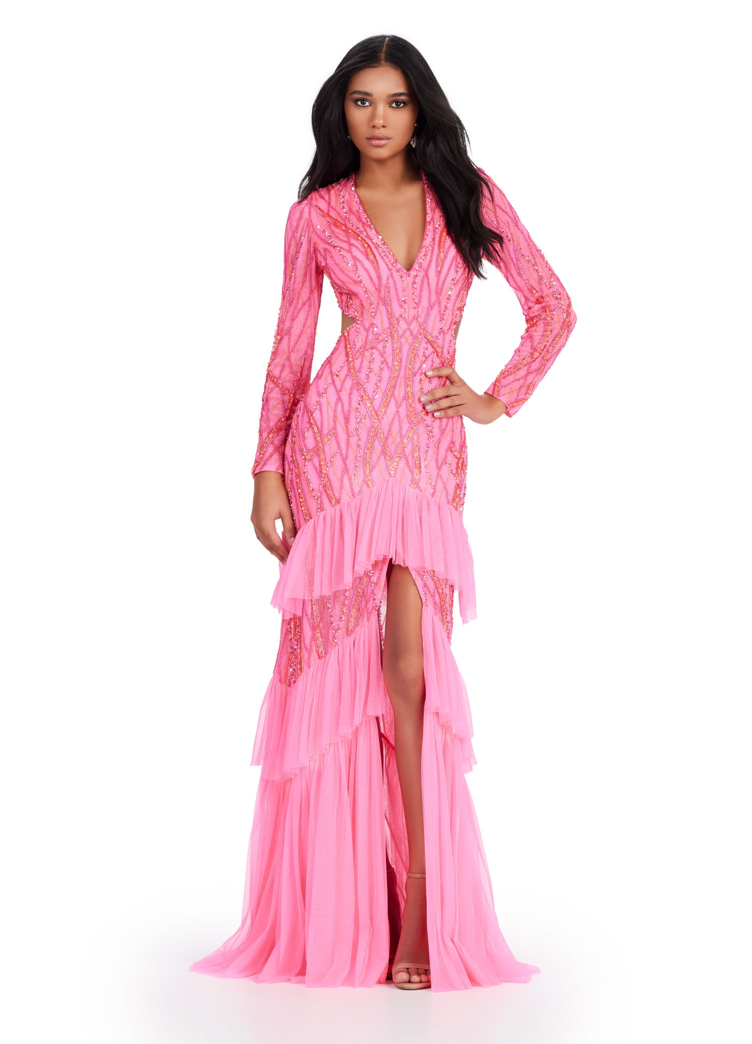 Step into elegance with the Ashley Lauren 11436 Long Prom Dress. This stunning gown features delicate beading, a flattering V-neckline, and a daring center slit with ruffled detailing. With its long sleeves, this dress is the perfect choice for a cool evening event. Make a statement in this formal gown. Fall in love with this gorgeous fully beaded long sleeve gown. Featuring an open back and center slit, this dress embodies effortless allure!