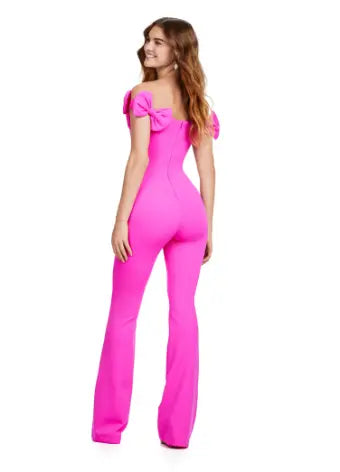 Introducing the Ashley Lauren 11439 Formal Scuba Jumpsuit, featuring a beautiful off shoulder design with elegant bow details. Made with high-quality scuba fabric, this jumpsuit offers a comfortable and sleek fit for any prom or formal occasion. Show off your fashion-forward style with this must-have piece. Strike a pose in this fun-fashion scuba jumpsuit! With the cutest off shoulder bow sleeves, this piece will give you the confidence you need at any event!