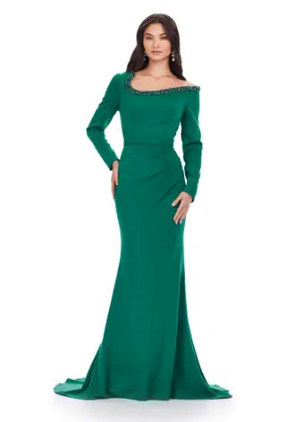 Feel like a queen in the Ashley Lauren 11450 Long Prom Dress. This stunning gown features a long sleeve scuba design, adorned with intricate beadwork and an asymmetrical neckline. Perfect for a formal event or pageant, this dress exudes elegance and sophistication. Can you say chic? This classic long sleeve scuba gown features an asymmetric beaded neckline that is perfect for your next event.