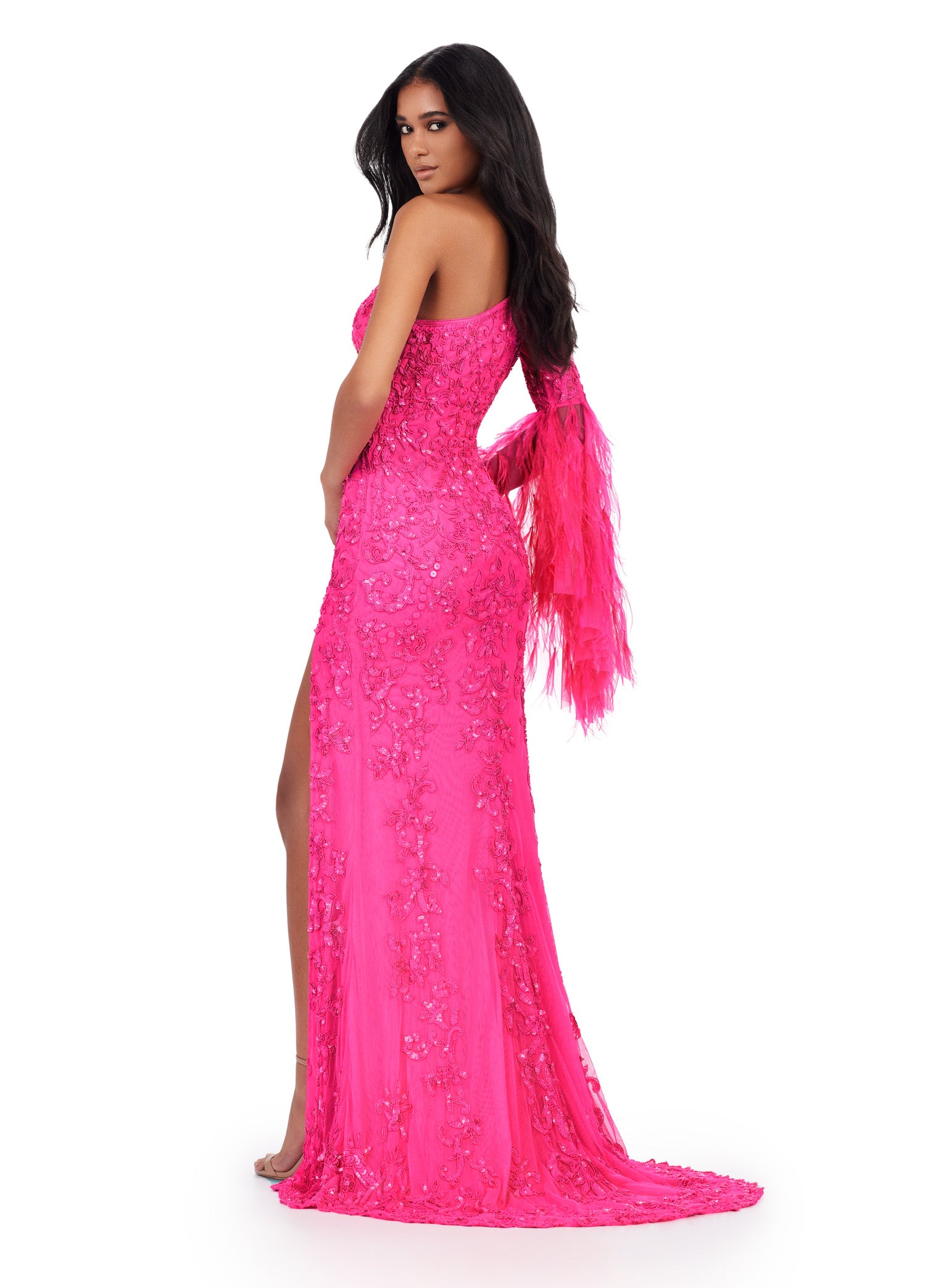 Make a statement in the Ashley Lauren 11452 Long Prom Dress. This stunning gown features a one shoulder design and full sequin embellishments, perfect for standing out at prom or a formal pageant. The bell sleeves add a touch of elegance to this standout piece. Available in multiple sizes. Elegant and fab! This one shoulder, fully beaded gown features a left leg slit and a dramatic feathered bell sleeve that takes this look to the next level.