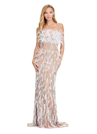 This Ashley Lauren long prom dress features a strapless, fully beaded bodice and a stunning feathered skirt, making it the perfect choice for any formal pageant. The intricate detailing and elegant design truly make this gown stand out and ensure you'll make a statement at any event. We're here for this look! This fully beaded strapless gown features an intricate beaded design and feathers throughout to help you stand out at your next event.