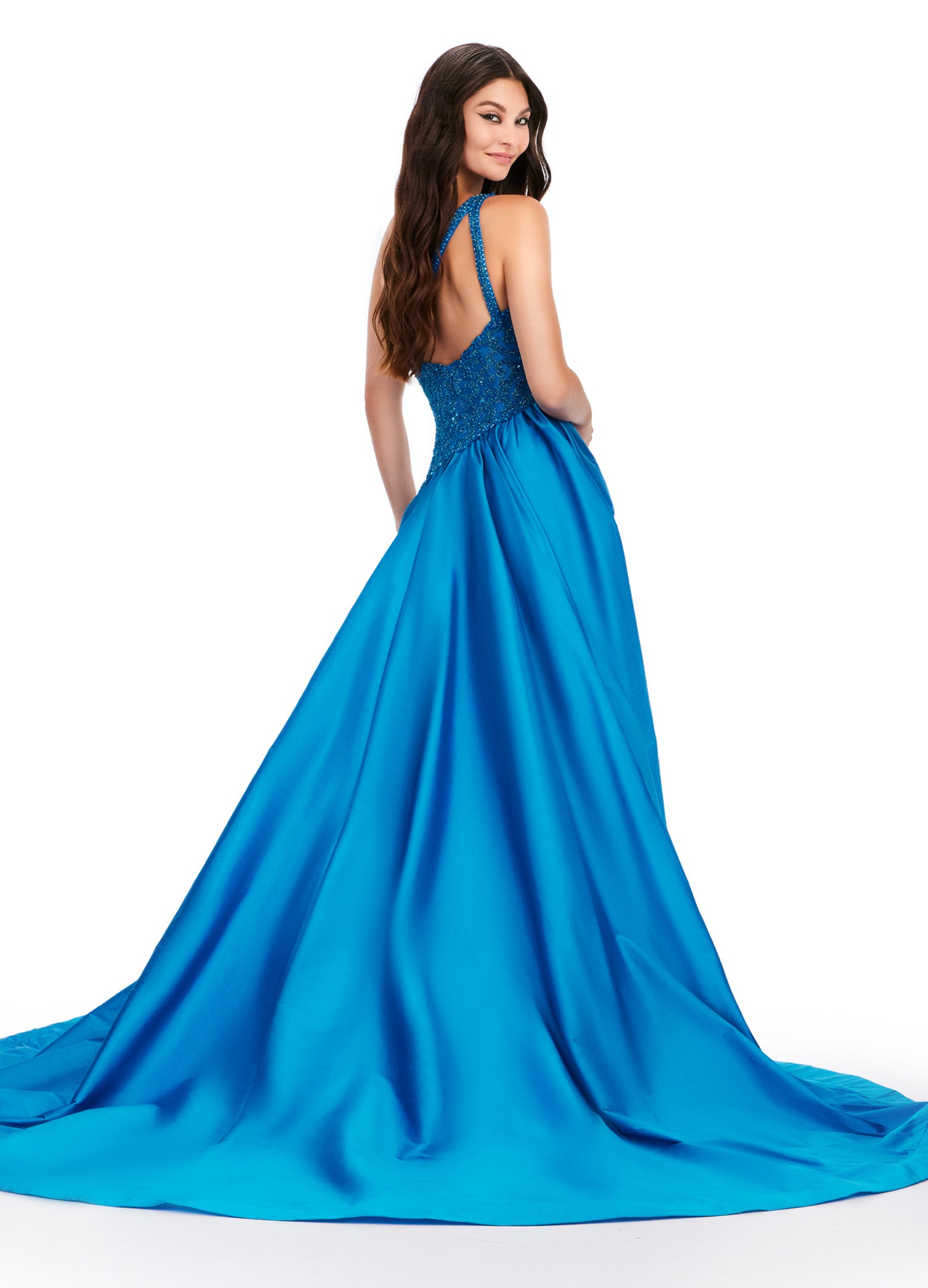 This Ashley Lauren 11456 Long Prom Dress features a one shoulder design with a beautiful taffeta fabric and a stunning beaded bodice. Elevate your formal look with this pageant-worthy gown. Expertly crafted with attention to detail, this dress is sure to make a statement. A dress sure to make you feel like royalty! This one shoulder gown features a fully beaded bodice and a dramatic taffeta overskirt.