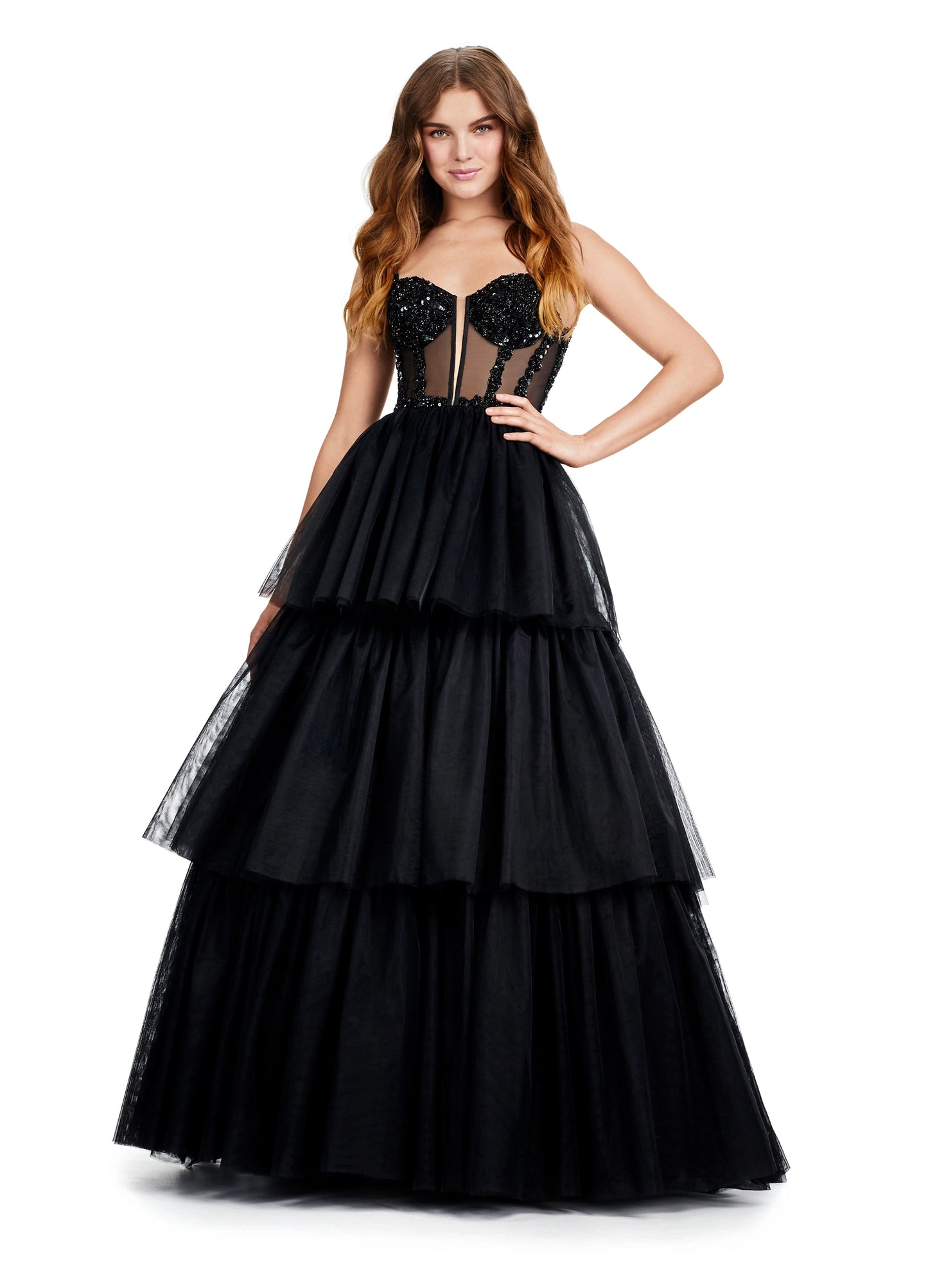 The Ashley Lauren 11462 Sheer Beaded Corset Layer Tulle Prom Dress Ballgown Pageant Tiered Gown is a statement-making piece. Crafted from sheer corset layers, delicate beadwork, and tiered tulle, it's perfect for any special occasion. Elegant and eye-catching, this dress features the perfect balance of comfort and sophistication.