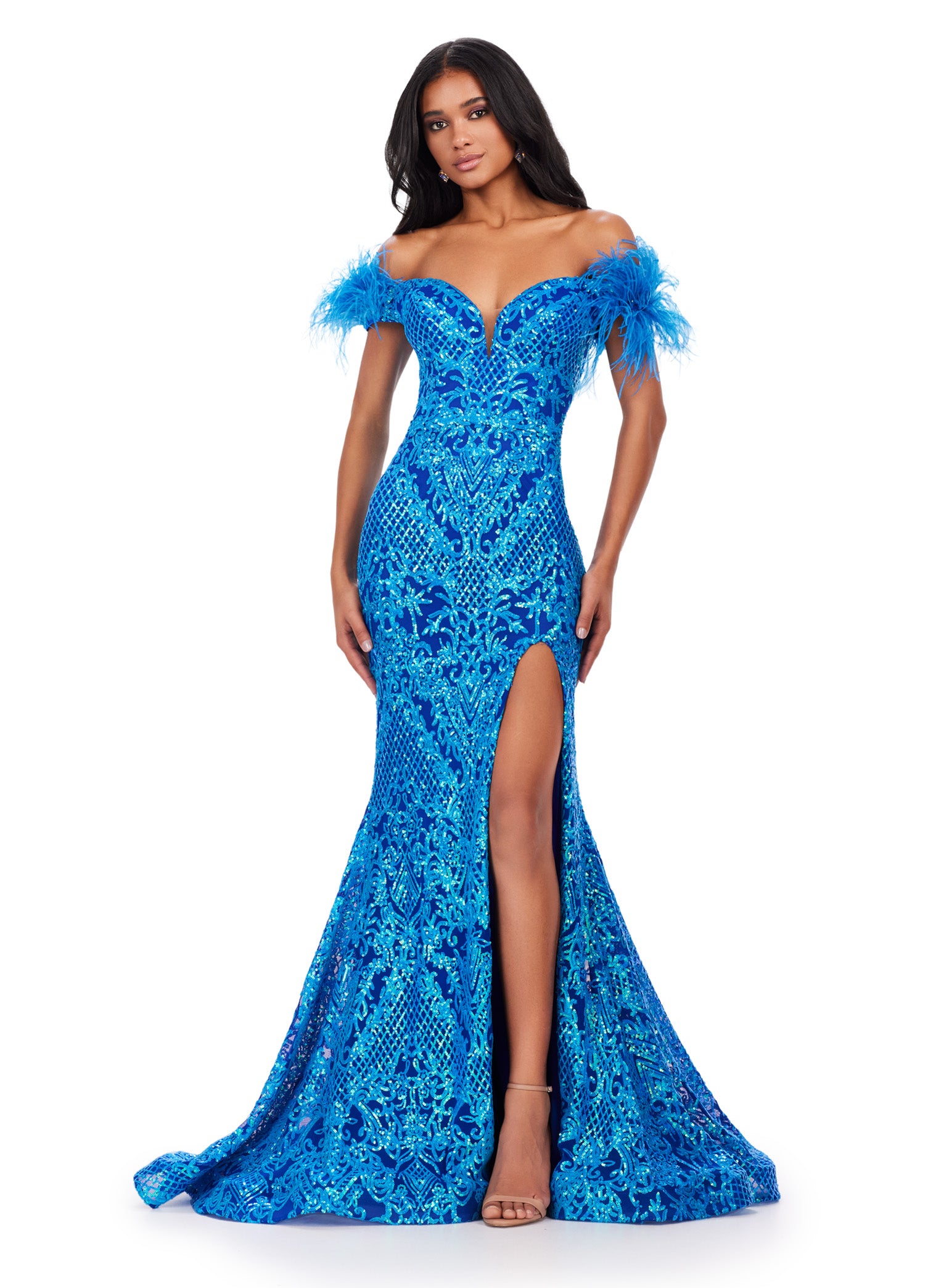 Elevate your prom look with the stunning Ashley Lauren 11463 Long Sequin Mermaid Prom Dress. The off the shoulder design and feather embellishments add a touch of glamour, while the slit detail adds a touch of flirtiness. This dress is perfect for making a statement on your special night. Stand out in this off the shoulder stretch sequin gown. We are living for this sweetheart neckline and feather details.