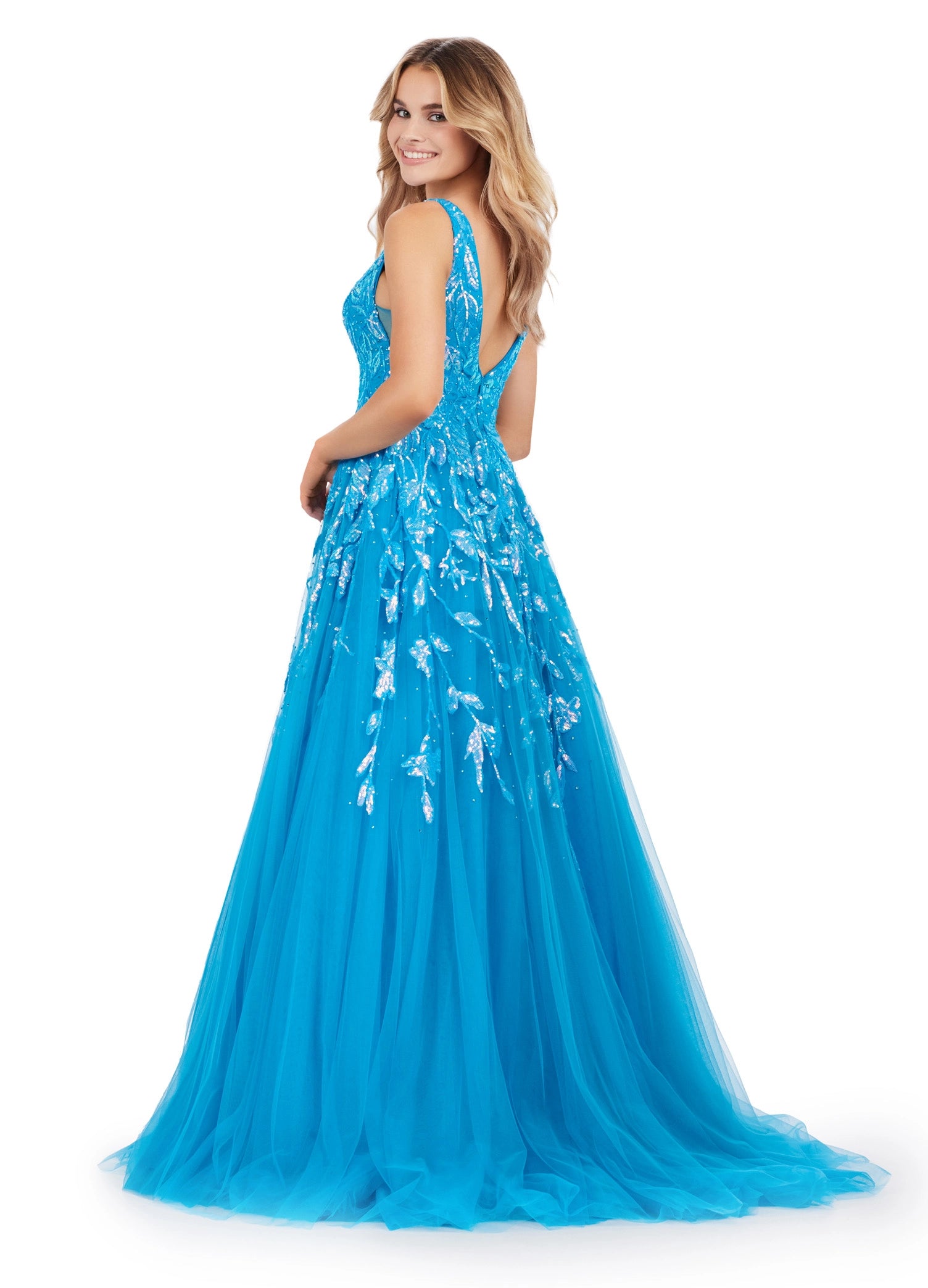 This Ashley Lauren 11470 Prom Dress will make a statement at any occasion. Made with sequin fabric and a pleated tulle skirt, the A-line silhouette will flatter any body shape, while the V-neckline adds a touch of sophistication. This glamorous gown is the perfect choice for making a lasting impression. 