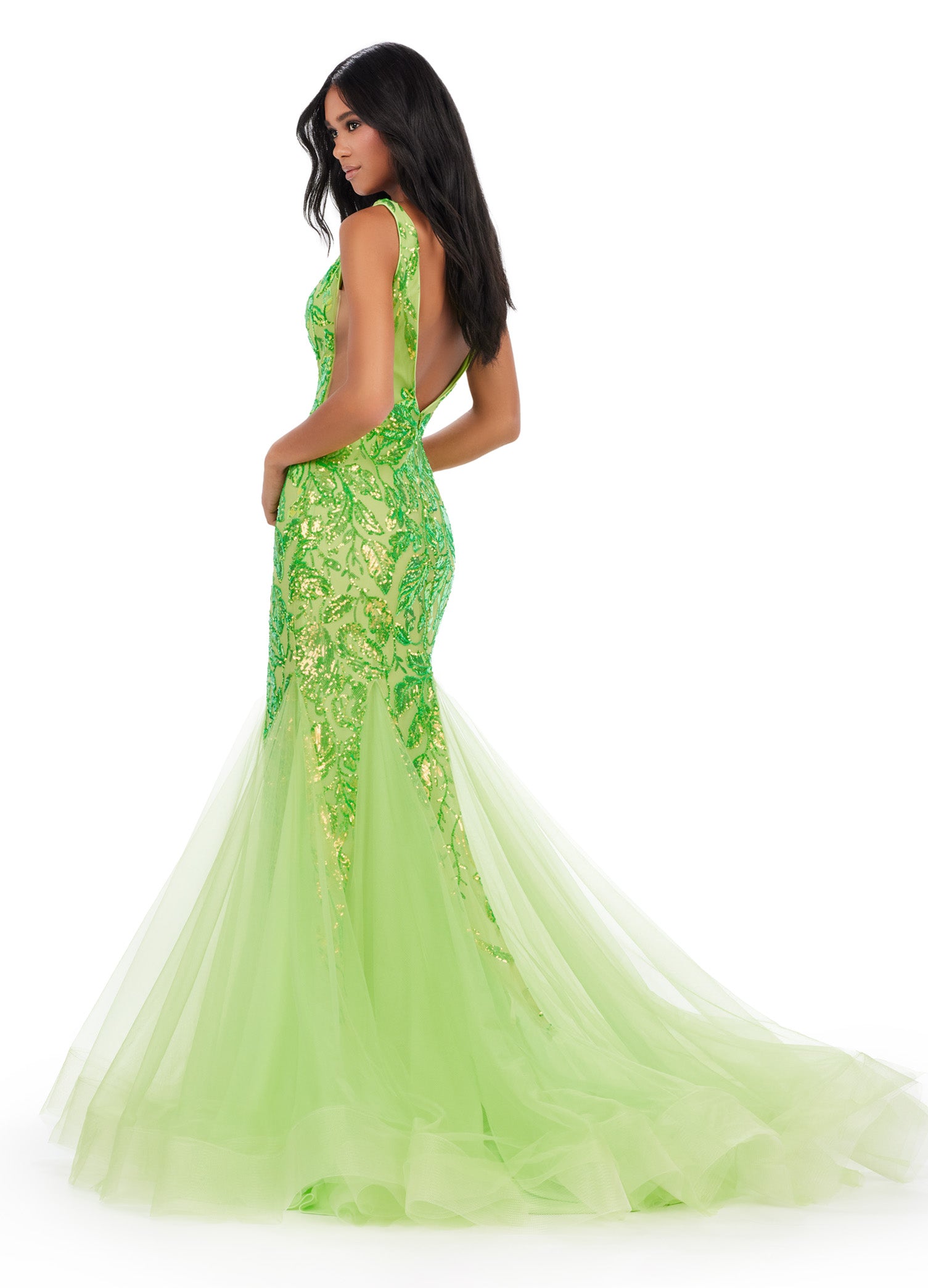 Get ready to command attention in the Ashley Lauren 11472 Long Prom Dress. With a stunning V-neck, sequin embellishments, and a mermaid skirt made with stretchy fabric, this gown is designed to enhance your figure and make you shine. Perfect for formal events, pageants, and more. Can you say iconic? This stretch sequin gown features a v-neckline and a pleated tulle skirt to help you slay your next event.