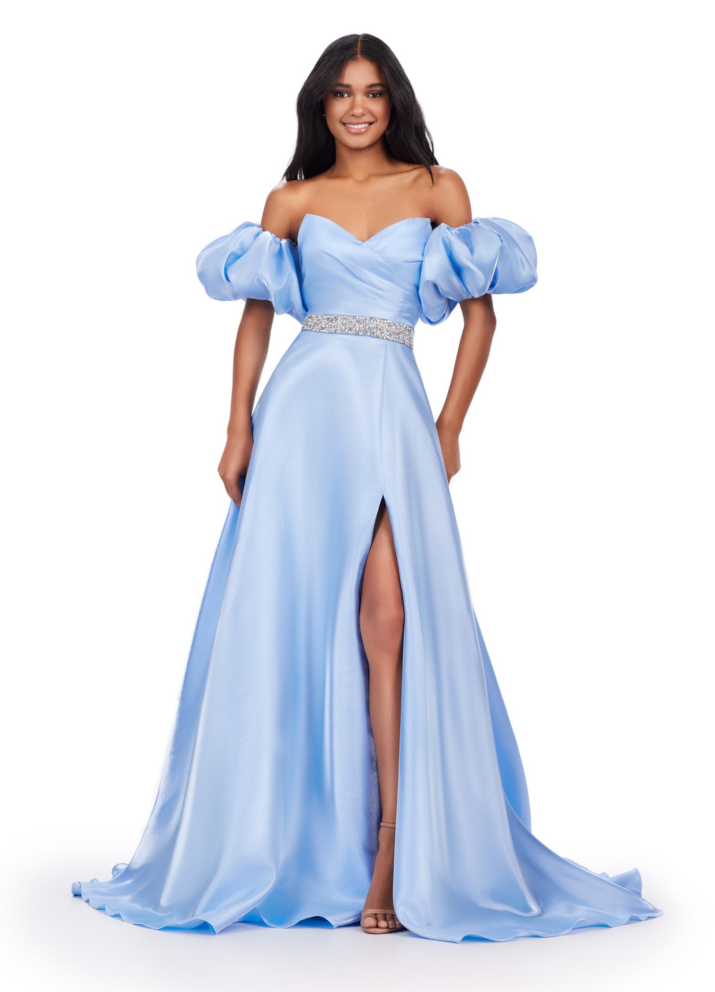 Elevate your formal look with the Ashley Lauren 11474 Long Prom Dress. This elegant strapless satin ball gown boasts a beaded belt, detachable puff sleeves, and a timeless pageant-style design. Perfect for making a statement at any event, this dress exudes sophistication and style. Be memorable in this strapless satin ball gown. This dress features a beaded belt detail, a left leg slit and detachable puff sleeves.