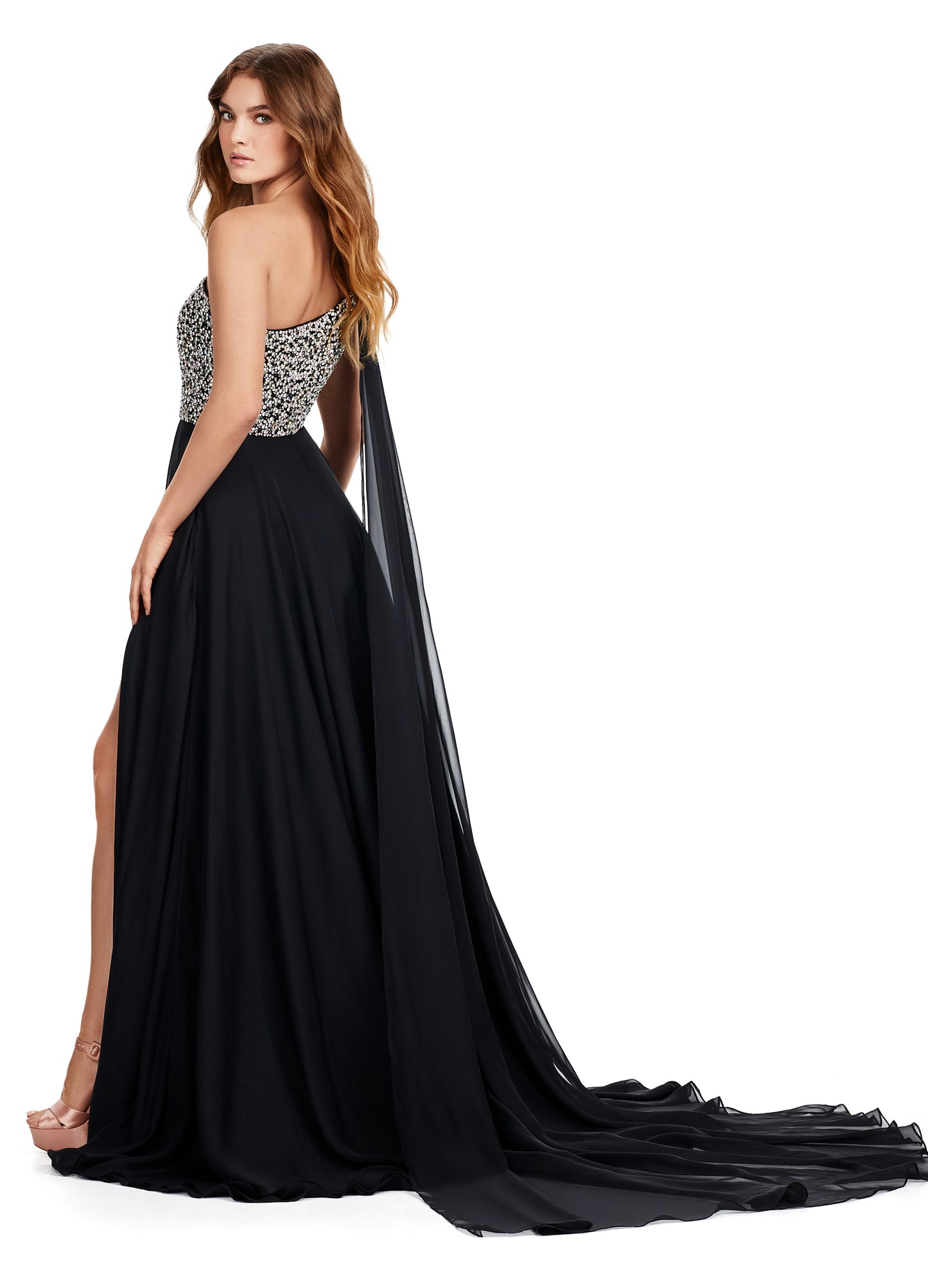 Introducing the show-stopping Ashley Lauren 11482 Long Prom Dress! This elegant gown features a one-shoulder design and flowing chiffon fabric, perfect for any formal occasion. The stunning beaded bustier adds a touch of sparkle and glamour, making you the center of attention. Elevate your style with this must-have pageant gown. A dress fit for a queen!