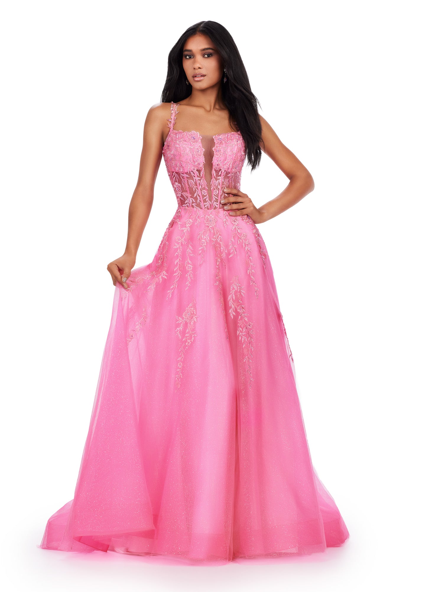 Step into the spotlight in the Ashley Lauren 11526 Long Prom Dress. Featuring spaghetti straps, a V-neckline, and a glitter tulle skirt, this gown is perfect for any formal event or pageant. With its elegant design and flattering silhouette, you'll feel like a star all night long. Living in a fairytale! This spaghetti strap gown features a v neckline with a lace applique bodice. The lace up back and glitter tulle skirt complete the look.