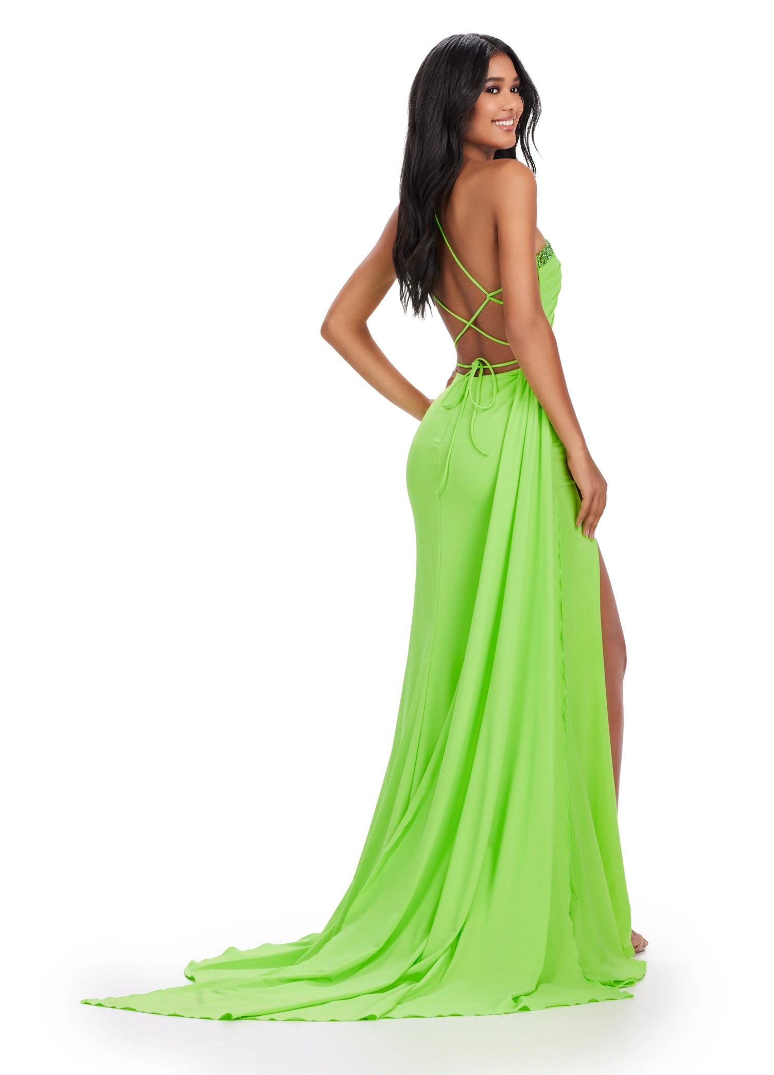 Look stunning at your next event with the Ashley Lauren 11539 long jersey one shoulder dress. This chic overskirt features a backless corset with a slit prom cut out and pageant detail. You will be sure to wow in this elegant evening gown. Be fabulously elegant in this one shoulder jersey gown. This dress features beaded details, cut outs and a lace up back complete with a side skirt for added drama.  COLORS: Coral, Lime, Black