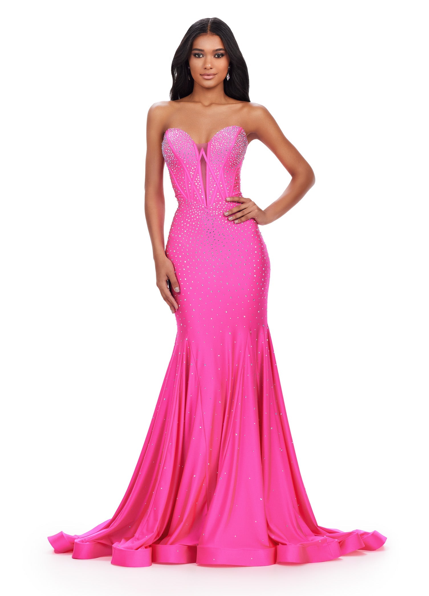 This elegant Ashley Lauren 11560 dress features a strapless neckline, fitted jersey fabric, and a mermaid silhouette that will accentuate your figure. The V-neck adds a touch of sophistication to this formal gown, making it perfect for prom or a pageant. Feel confident and beautiful in this stunning dress. This classic strapless jersey gown features a fully beaded corset bustier. The press on stones make this extra glamourous.