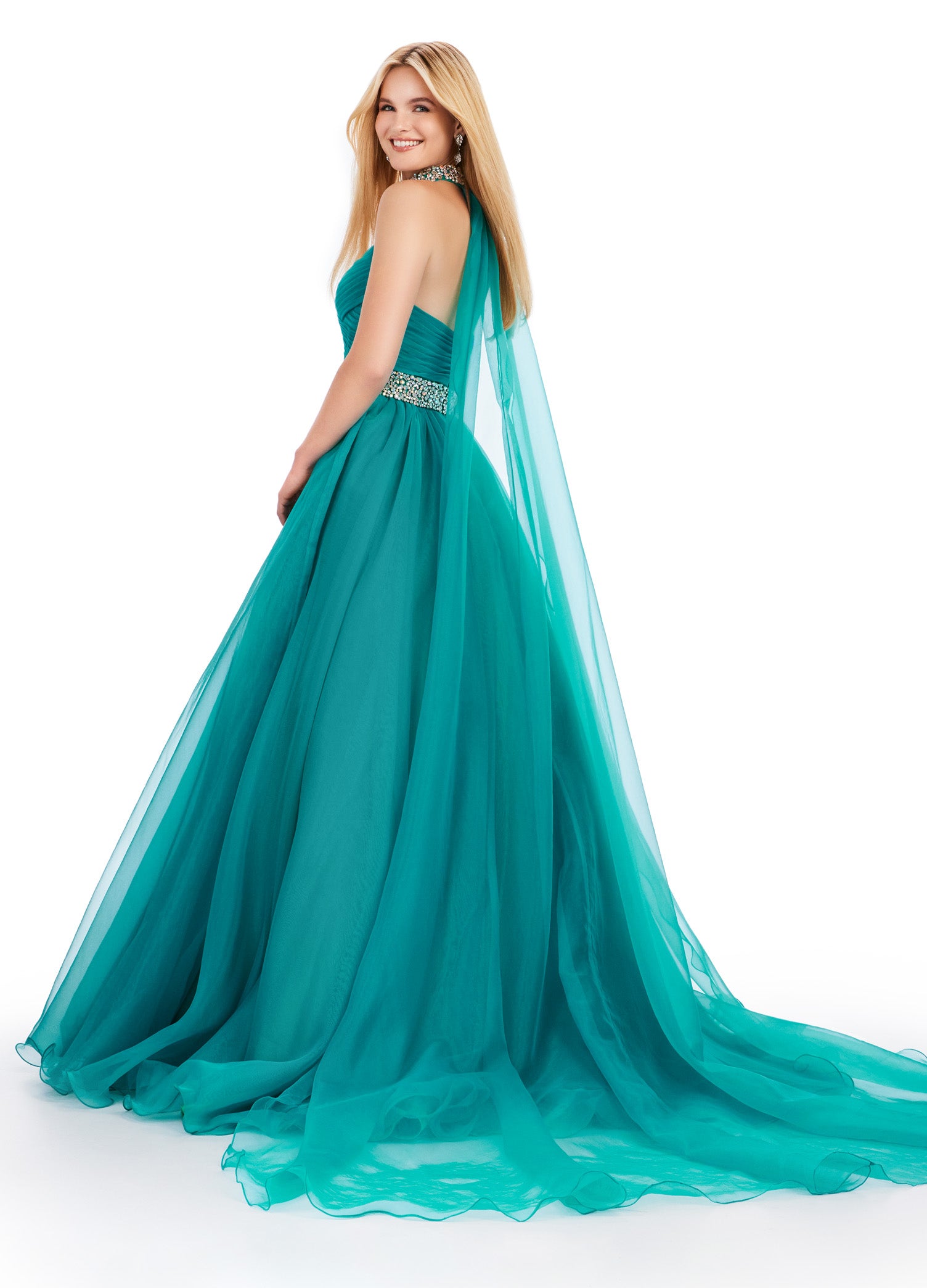 The Ashley Lauren 11565 Long Prom Dress is a stunning organza ball gown that features a beaded choker and a flowing cape, perfect for formal events or pageants. With its intricate beading and elegant design, this dress will make you feel like a true princess. A dress sure to make you feel like a queen. This strapless organza ball gown features a beaded waist band. The look is finished with a beaded choker and organza cape.