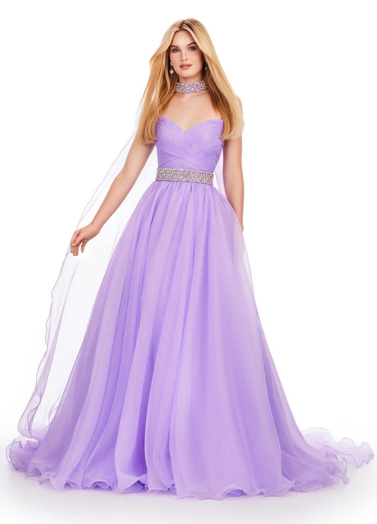 The Ashley Lauren 11565 Long Prom Dress is a stunning organza ball gown that features a beaded choker and a flowing cape, perfect for formal events or pageants. With its intricate beading and elegant design, this dress will make you feel like a true princess. A dress sure to make you feel like a queen. This strapless organza ball gown features a beaded waist band. The look is finished with a beaded choker and organza cape.