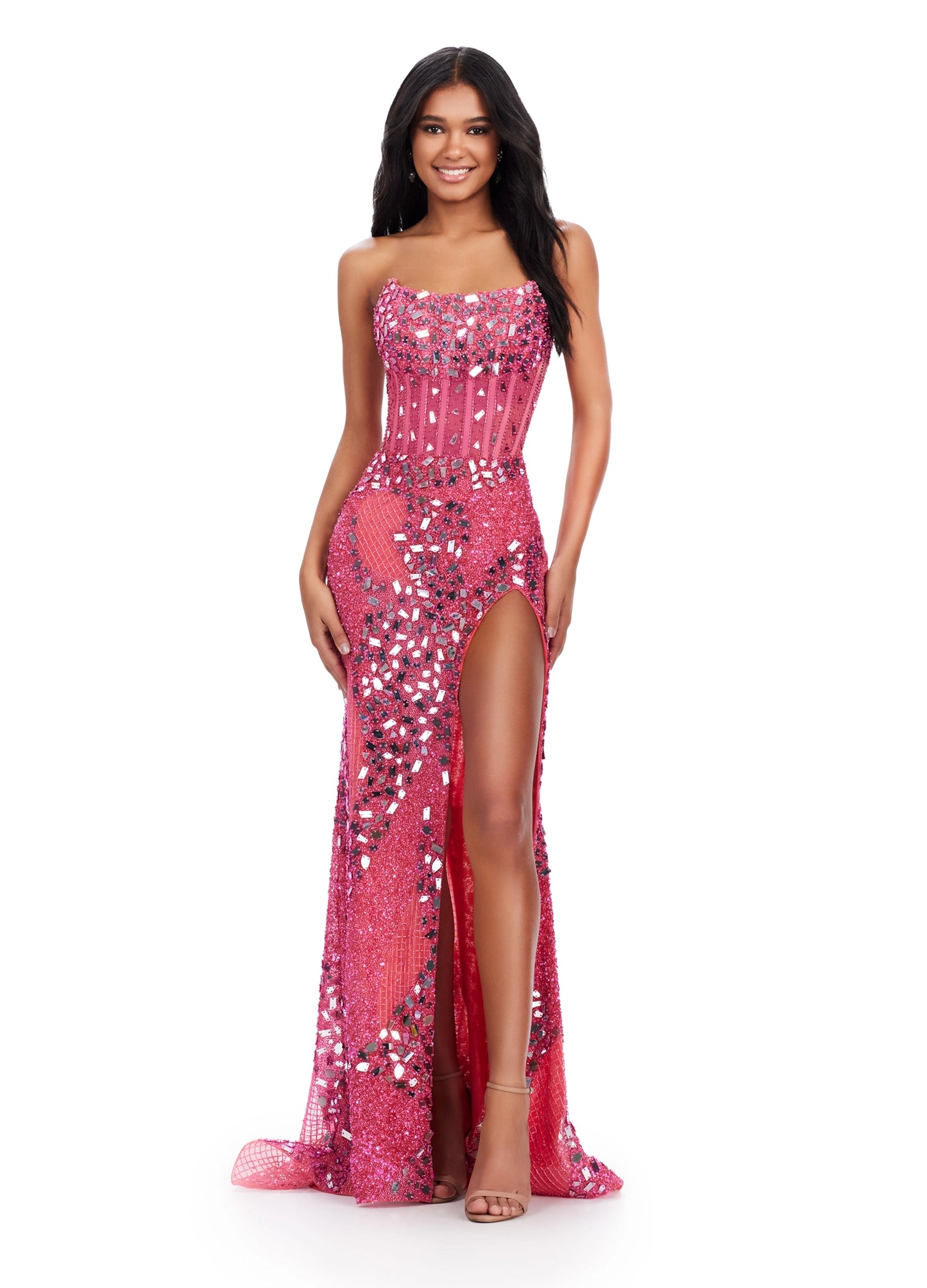 The Ashley Lauren 11599 prom dress is an eye-catching statement piece. Crafted from luxurious glistening cut glass fabric, this gown features an alluring corset-style bodice and a show-stopping thigh-high slit. The gleaming beaded embellishments add a touch of sparkle that is sure to make you shine