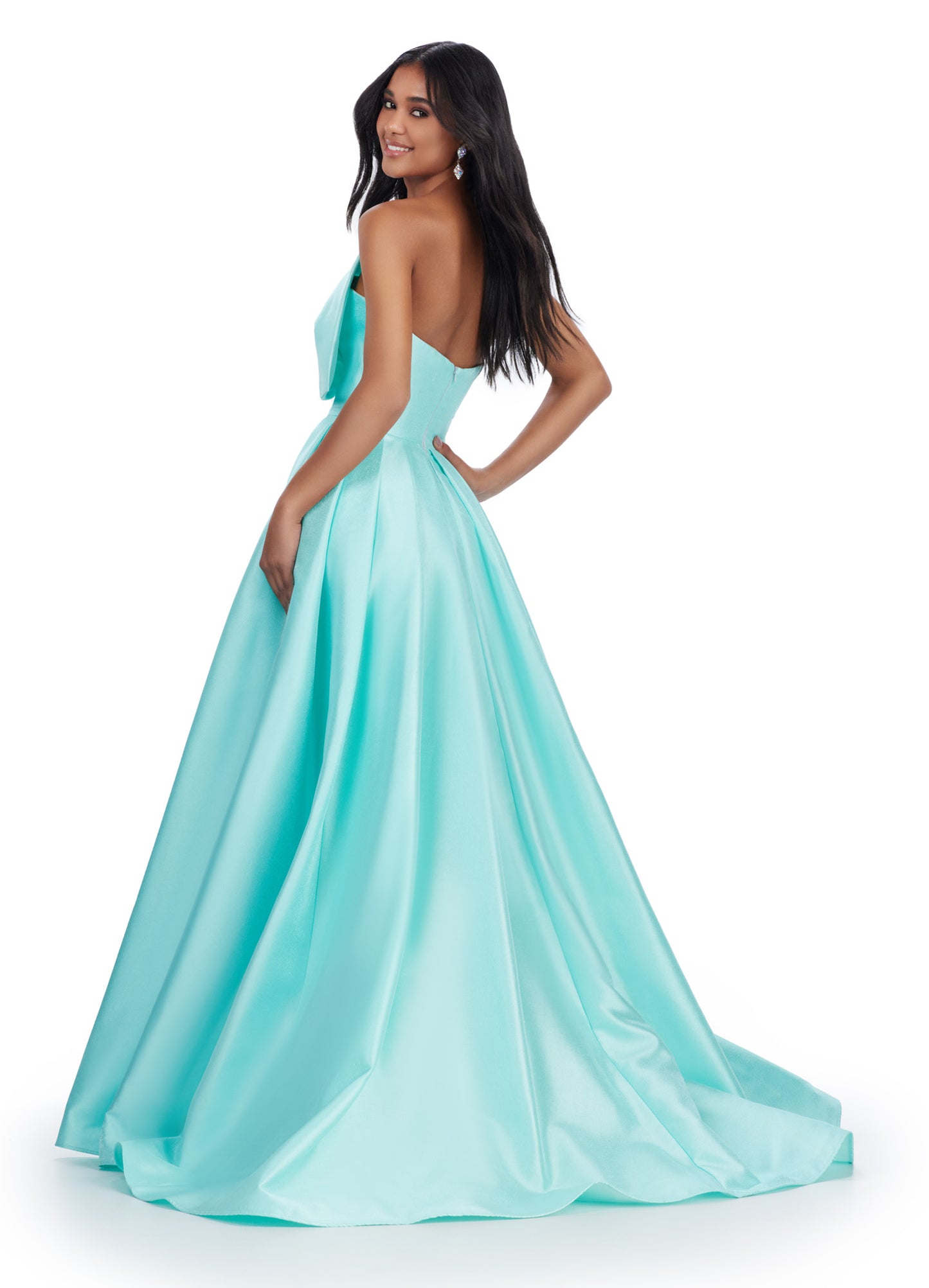 Discover the sophisticated elegance of the Ashley Lauren 11609 Long Prom Dress. Made with luxurious Mikado fabric, this strapless ball gown features an oversized bow for a dramatic touch. Perfect for formal events and pageants, this dress will make you feel like royalty with its timeless style and flattering silhouette. We love a bow moment! This strapless Mikado ball gown features an asymmetrical oversized bow with wrap skirt.