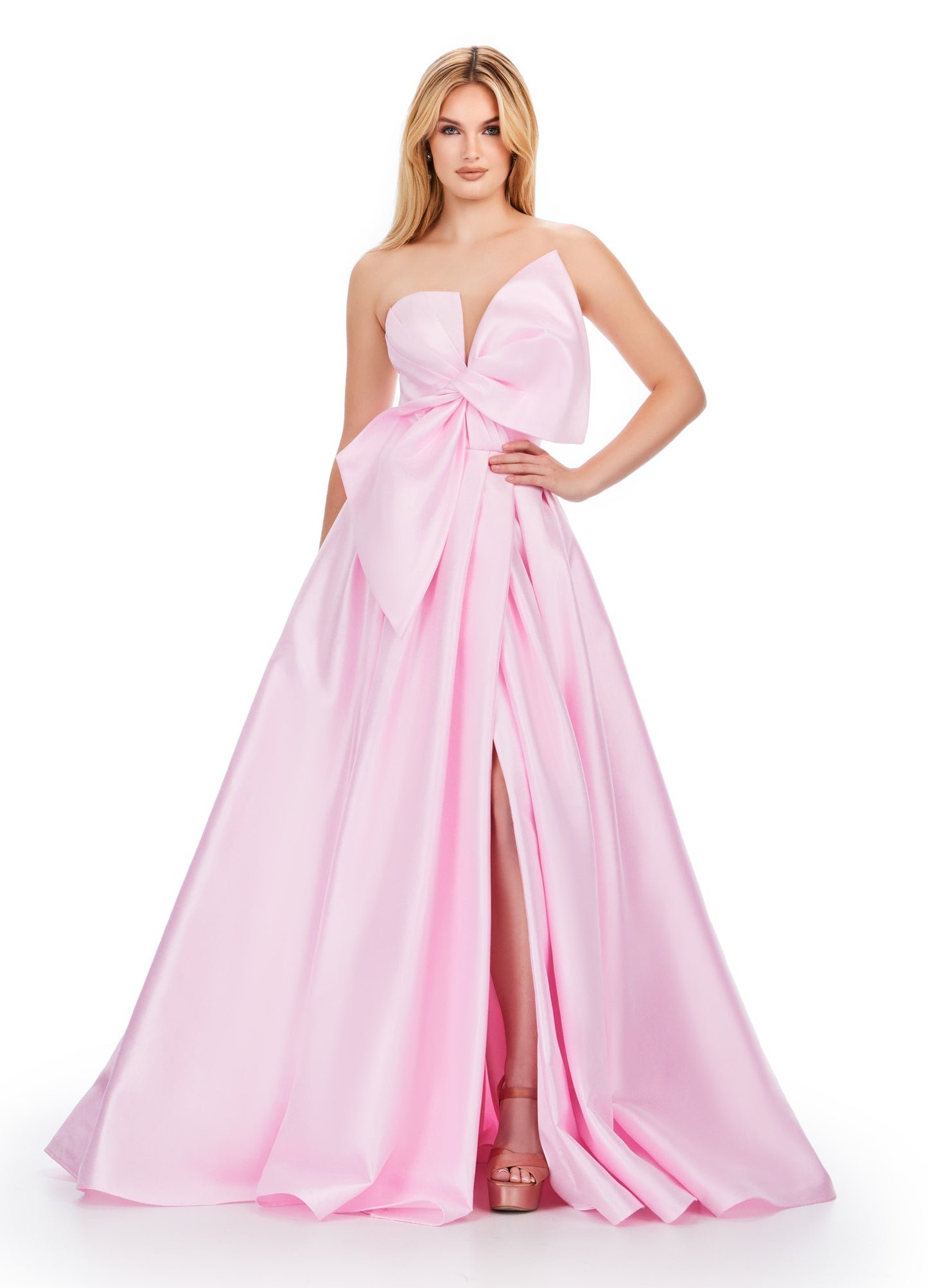 Discover the sophisticated elegance of the Ashley Lauren 11609 Long Prom Dress. Made with luxurious Mikado fabric, this strapless ball gown features an oversized bow for a dramatic touch. Perfect for formal events and pageants, this dress will make you feel like royalty with its timeless style and flattering silhouette. We love a bow moment! This strapless Mikado ball gown features an asymmetrical oversized bow with wrap skirt.